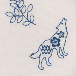Embroidered canvas fabric with wolves and deer, detail